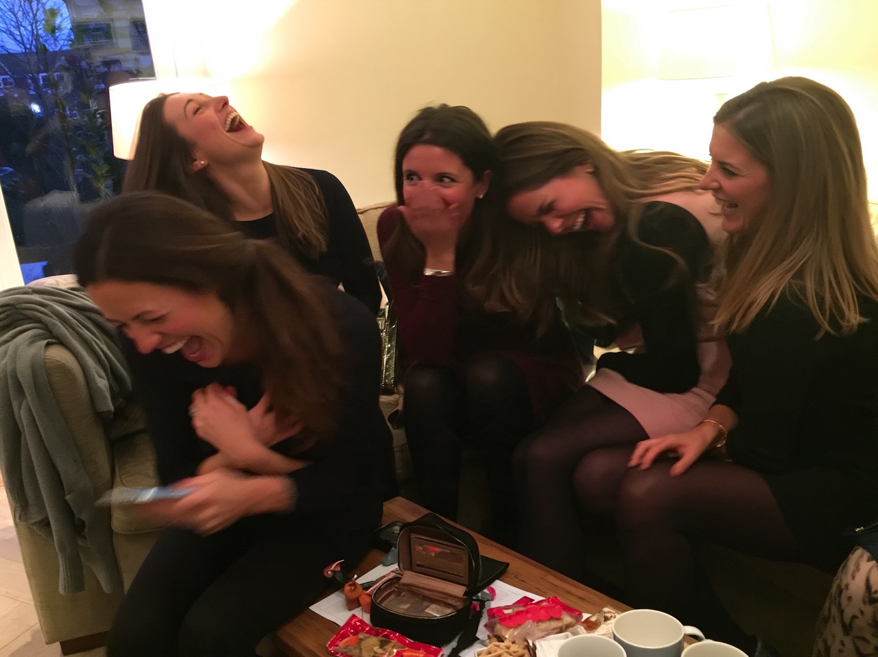 Friends laughing together during a hen weekend